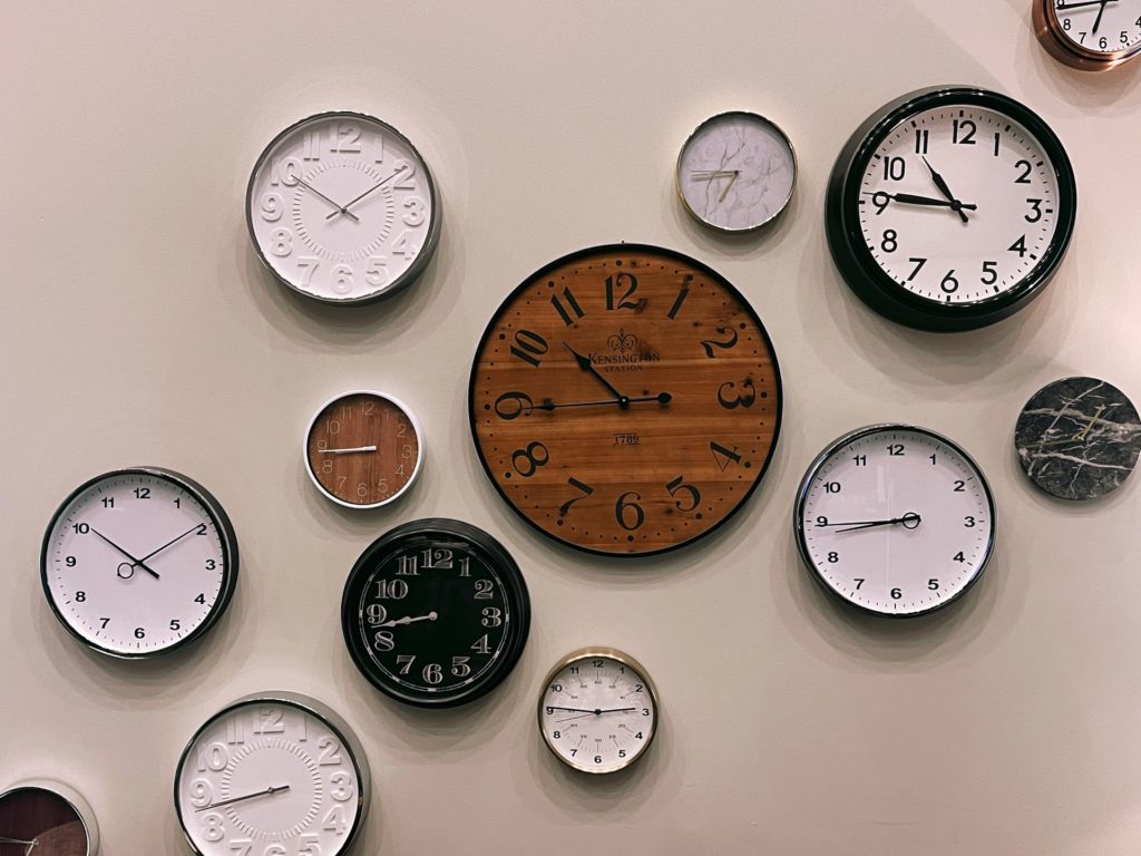 multiple clocks on the wall